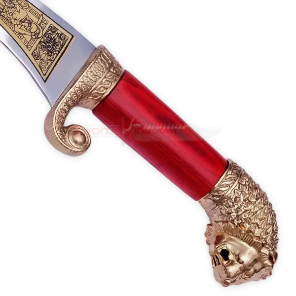 Close-up of Red Wooden-Style Handle with Gold Decorative Fittings
