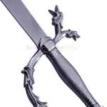 Detailed close-up of the ornate dragon-themed hilt and textured handle of the Arabian Scimitar.