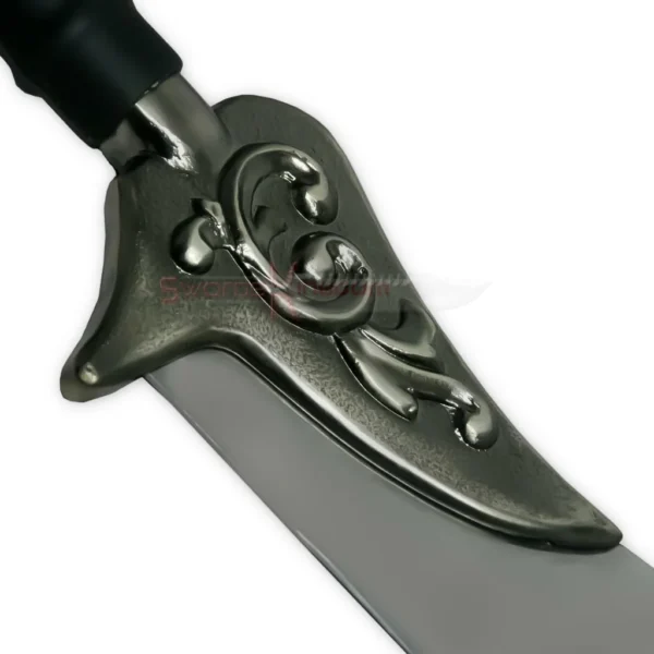Detailed view of the ornate metal guard on the Auron Katana sword replica with decorative scrollwork.