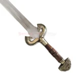 Close-up of the Brown Eowyn sword replica showing the ornate gold swan-shaped guard and brown handle.