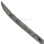Close-up of the 17-inch Champagne Sabre blade featuring engraved decorative markings and a curved cutting edge.