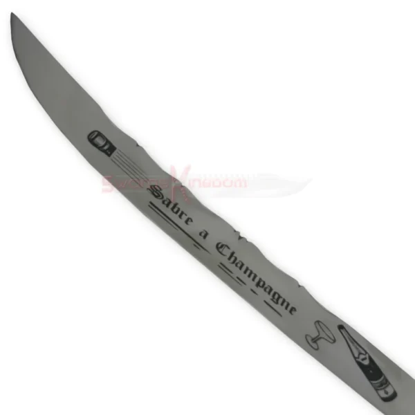 Close-up of the 17-inch Champagne Sabre blade featuring engraved decorative markings and a curved cutting edge.