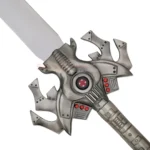 Close-up of the detailed silver hilt and decorative red accents on the HE-MAN Power Sword Replica