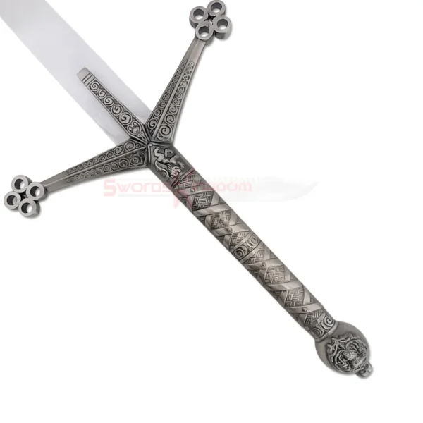 Detailed view of the ornate dark metal crossguard and engraved handle of the Black Knight Claymore sword.