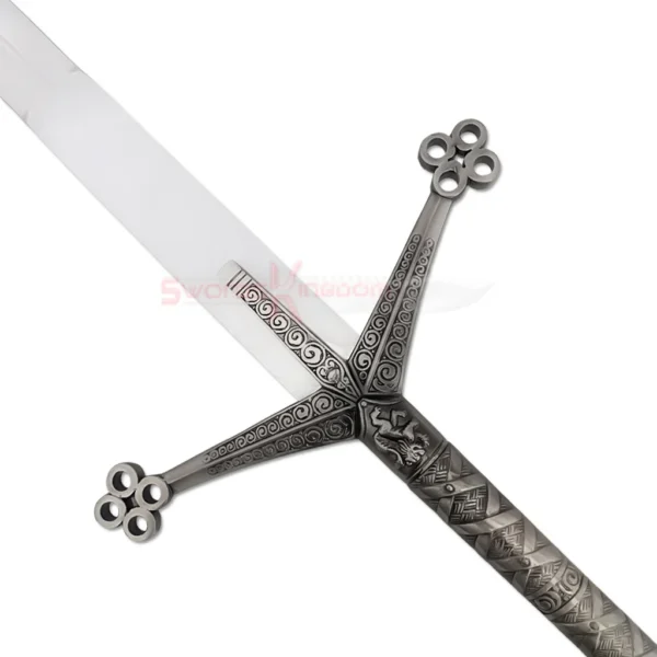 Close-up view of the silver blade and detailed crossguard of a medieval Black Knight Claymore sword.