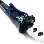 White-wrapped tsuka handle with traditional diamond pattern and gold menuki details