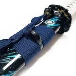 White-wrapped tsuka handle with traditional diamond pattern and gold menuki details