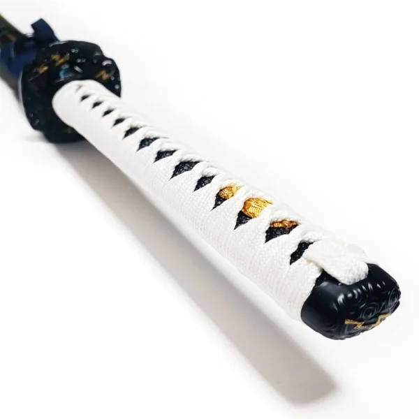White-wrapped tsuka handle with traditional diamond pattern and gold menuki details