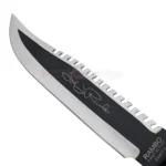 Close-up of the Sylvester Stallone John James Rambo First Blood Part 2 Signature Edition Knife Replica blade featuring the signature detail and serrated spine