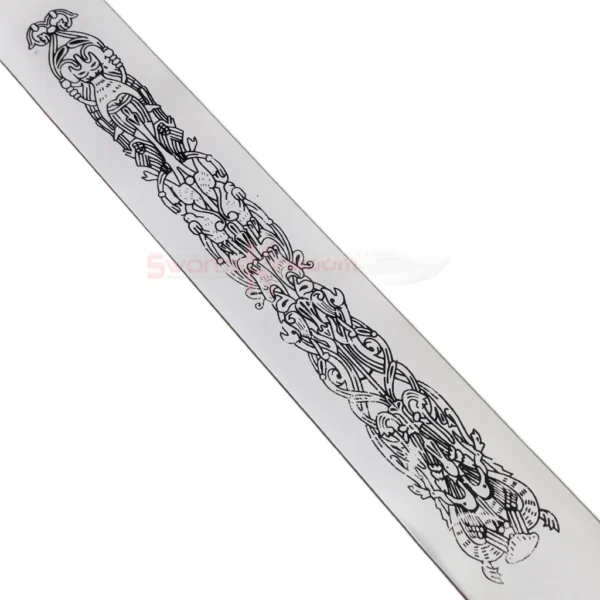 Detailed close-up shot of the intricate medieval pattern engraved along the center of the King Arthur Excalibur Sword in the Stone Gold Edition replica blade